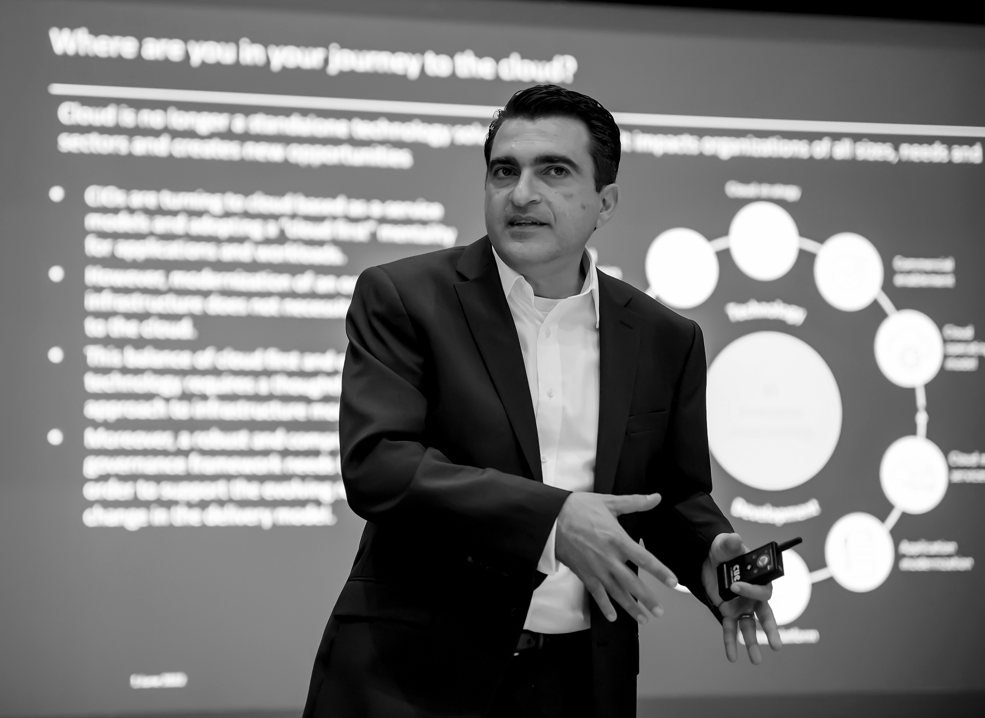 Michael Azzopardi speaking on stage